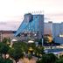 Estrel Hotel Berlin in Berlin with a distinctive glass facade and city view at dusk