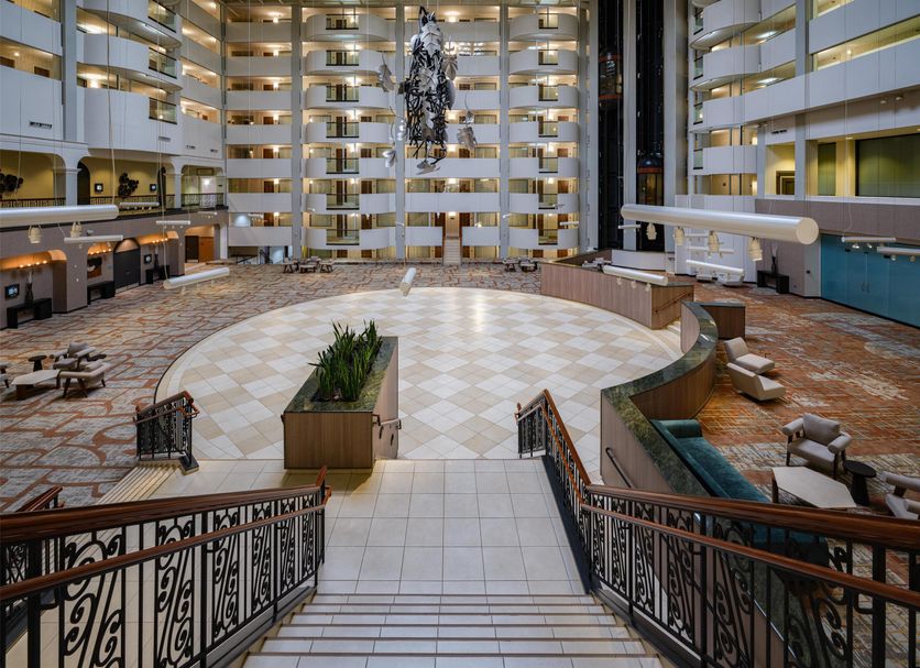 Hilton Washington DC/Rockville Executive Meeting Center atrium lobby with grand staircase and balconies in Rockville
