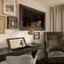 The Nikolai Hamburg - Leonardo Limited Edition room with wall-mounted TV, armchair and city-view window