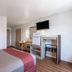 Motel 6 Junction City, KS room with bed, desk, TV, mini fridge and microwave
