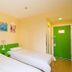 Hi Inn Beijing Shangdi Anningzhuang twin room with two single beds and green door in Beijing