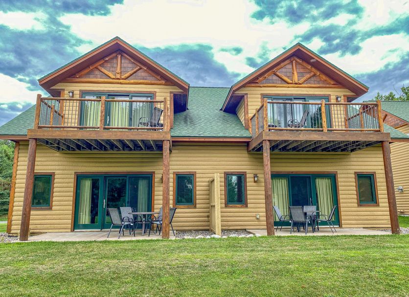 Ruttger's Bay Lake Resort in Deerwood with a two-story lodge, twin balconies, and patio seating