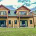 Ruttger's Bay Lake Resort in Deerwood with a two-story lodge, twin balconies, and patio seating
