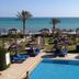 Hotel de charme et SPA Dar El Bhar in Midoun with pool, palm trees, and sea view