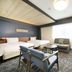 Richmond Hotel Yokohama-Bashamichi guest room with two beds, sofa, desk and TV in Yokohama