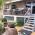 Il Giardino Di Adriana in Terracina with palm garden, flower pots, and staircase to terrace