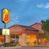 Super 8 by Wyndham Belen NM exterior at dusk with illuminated sign and entrance in Belen