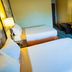 Super 8 by Wyndham Belen NM guest room with two double beds, TV, desk, and lamps