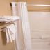 Super 8 by Wyndham Belen NM bathroom with shower-tub combo, grab bars, and towel rack in Belen