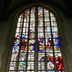 De Utrechtsche Dom in Gouda, tall stained-glass church window with colorful figures