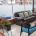 Hotel Casa Lamay Bogotá lounge with sofa, blue chairs, coffee table and frosted window view