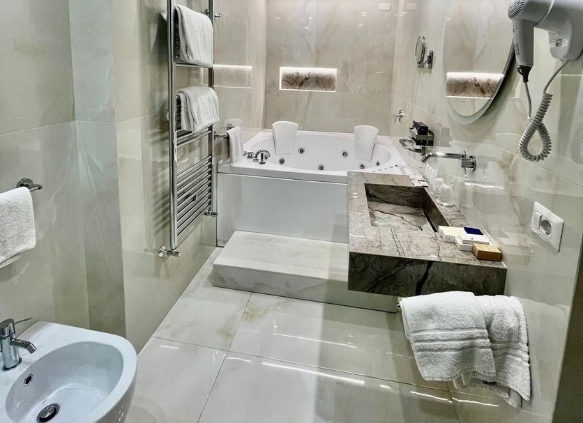Hotel della Valle, Agrigento bathroom with soaking tub, walk-in shower, bidet and marble vanity