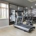 DoubleTree by Hilton Stratford upon Avon fitness room with treadmill, dumbbells, and exercise ball