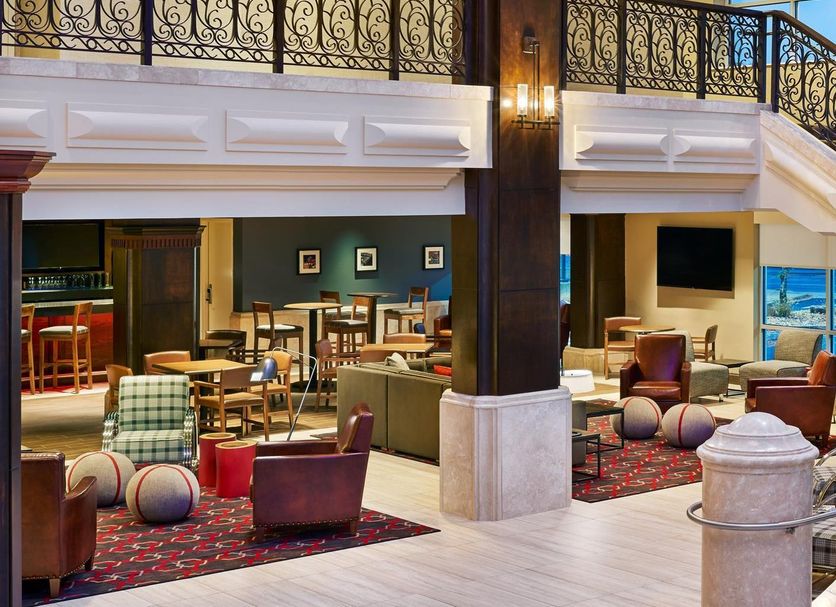 Four Points by Sheraton Little Rock Midtown lobby with seating area and staircase