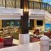 Four Points by Sheraton Little Rock Midtown lobby with seating area and staircase