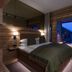 Skarsnuten Mountain Resort & Spa in Hemsedal bedroom with large window view of snowy mountains