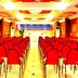 Hotel Sea View in Kanyakumari conference hall with rows of red chairs facing a stage