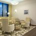 Hampton by Hilton Minsk City Centre lounge seating area with chairs, tables and floor-to-ceiling windows