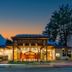 Katathani Phuket Beach Resort in Karon with illuminated resort entrance at dusk
