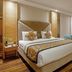 Hotel Waves, Delhi Airport room in New Delhi with king bed, wooden floors and seating area