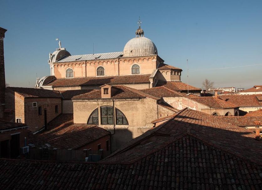 Hotel Pensione Wildner in Venice with a view over terracotta rooftops and a domed church