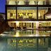 Centara Pattaya Hotel in Pattaya with illuminated pool and modern terrace dining at night