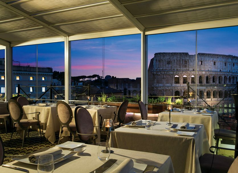 Palazzo Manfredi in Rome dining room with Colosseum view at dusk