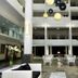 Sand & Sandals Desaru Beach Resort & Spa lobby atrium in Bandar Penawar with hanging lights and seating