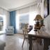 Panorama Junior Suites in Kavála room with city-view windows, chaise lounge, desk and chair