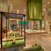 ITC Gardenia, a Luxury Collection Hotel, Bengaluru lobby with green swing seating and indoor garden