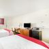 Oyo Hotel San Antonio Lackland AFB/Seaworld Hwy 90 W guest room with two beds, TV, desk and mini fridge