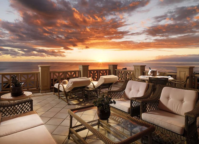 Joia El Mirador By Iberostar in Adeje: ocean-view terrace with lounge chairs and sunset sky
