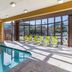 Extended Stay America Suites - San Rafael - Francisco Blvd East indoor pool with lounge chairs and large windows