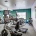 Quality Inn & Suites Bethany - Oklahoma City West fitness room with treadmills, ellipticals and mirrored wall