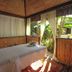 Casa Nostra Boutique Hotel in Paraty: serene spa massage room with open-air garden views