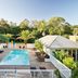 Atlantic Byron Bay in Byron Bay with a rooftop pool, sun loungers and lush tropical trees