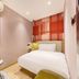 Lavande Hotel Guangzhou Yongqingfang Zhongshan 8th Road Metro Station room with bed, mirror, and side table in Guangzhou