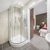 Hawksmoor Guest House, Windermere: en-suite bathroom with curved glass shower beside bedroom doorway