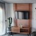 Apart Hotel Brisas do Amor in Pipa room with wall art, TV, wooden door and cactus decor