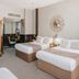 The Coal Exchange Hotel Cardiff room with two beds, ornate mirror, and classic decor