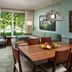 The Westin Princeville Ocean Resort Villas living area with seating, dining table and tropical garden view in Princeville