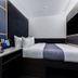 The Z Hotel Holborn, London guest room with compact bed, desk, and wall-mounted TV