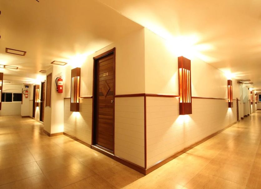 Ao Nang Beach Resort in Krabi hallway with warm lighting and tiled floors