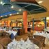 Melia Santiago De Cuba restaurant with set tables and colorful ceiling in Santiago de Cuba