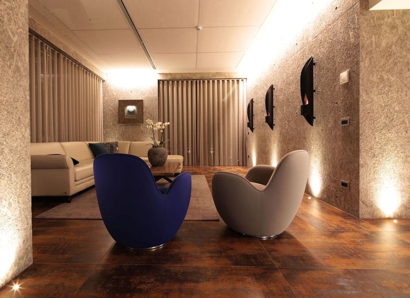 Hotel Ristorante La Rosina in Marostica lobby lounge with modern chairs, sofa, and warm lighting