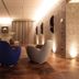 Hotel Ristorante La Rosina in Marostica lobby lounge with modern chairs, sofa, and warm lighting