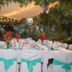 Las Brisas Resort and Villas in Jacó: outdoor event table setup under string lights with tropical greenery