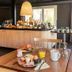 Breakfast buffet and dining table at Campanile Nature - Paris Ouest Gennevilliers Port in Gennevilliers