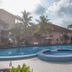 Hotel Seri Malaysia Mersing in Mersing: outdoor pool with circular hot tub, palm trees and lounge area