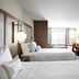 Fairfield Inn & Suites by Marriott Sheboygan guest room with two beds and a window seating area